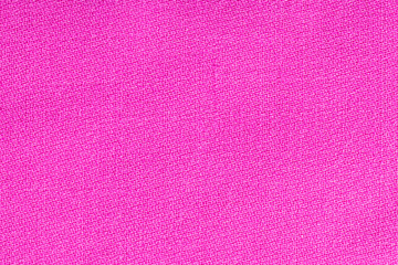 Pink fabric background texture. Detail of textile material close-up