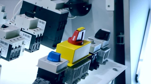 Person clicks pushing on the control panel buttons and pressing the lever close-up. Person tilts the lever to turn it on oa turn off. Control buttons panel close-up.