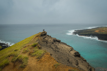 Peak of green sand beach hill