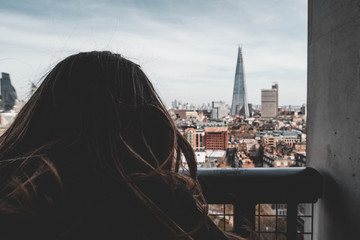 Fototapeta na wymiar Woman looking at the London skyline