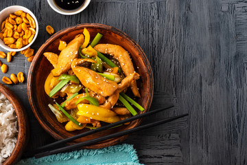Kung Pao chicken, stir-fried Chinese sichuan traditional sichuan  dish with chicken, peanuts, vegetables and chili peppers.