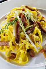 Home-made tagliatelle with turkey, mushrooms and truffle sauce