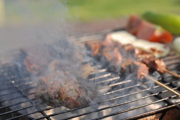 Traditional Cypriot meze and kebap barbecue party in the garden with delicious mix meat and chicken kebaps