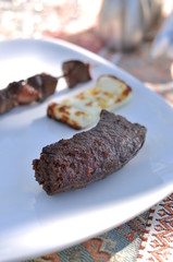 Traditional Cypriot meze and kebap barbecue party in the garden with delicious mix meat and chicken kebaps