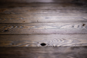 Dark wood board or table top at the workshop