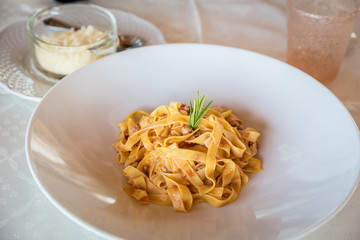 dish of ragout tagliatelle handmade in a restauarnt, italian food