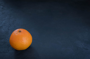 Fresh juicy clementines tangerines, fruits in winter. on a black background. horizontal view of...