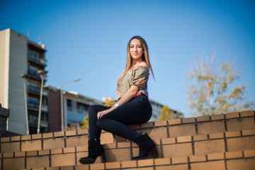 Fototapeta premium Photographing a girl during autumn with a blurred background