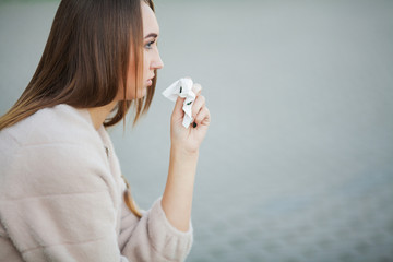 Woman stressed from work while sitting outdoors, press from colleagues