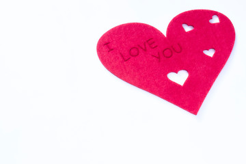 Fototapeta premium scattered red hearts on a white background. Excellent background to the day of Saint Valentine.copy space