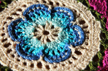 Macro image of handmade knitted flower