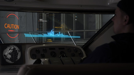 The young guy (man) of the yacht garage includes a futuristic panel which is leveled by a hologram on which the direction (course) is displayed as well as the size of the length of the ship. Future 