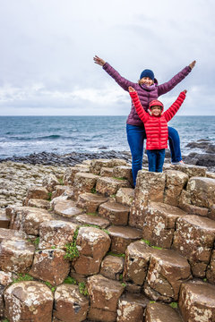 Mother And Daughter At Giants Causeway In Autumn, Northern Ireland