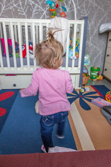 Child messing around in the room