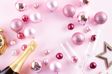 Christmas party with champagne, frame on pink background
