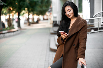 Fototapeta premium Beautiful model poses for the camera on the streets.