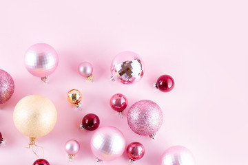 Christmas pink and golden decorations on pink background