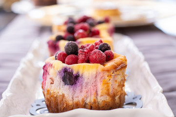 Muffins with fresh blueberry, blackberry, cranberry and strawberry
