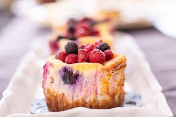 Muffins with fresh blueberry, blackberry, cranberry and strawberry