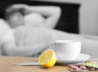 Illness concept. Sick man with fever lying in the bed.