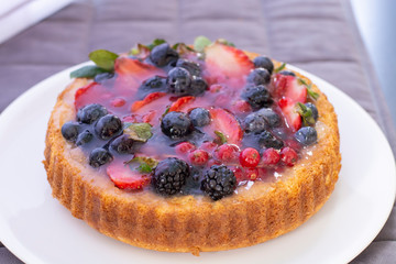 Cake with cranberry, strawberry, blueberry and blackberry