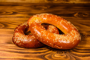 Bagels with sesame seeds on wooden table