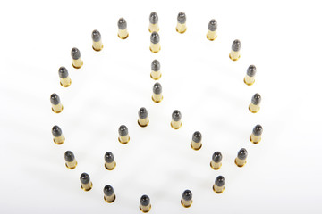 peace sign made of bullets.