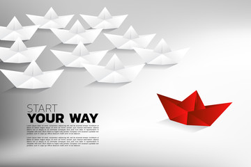 Red origami paper ship move to difference direction from group of white. Business Concept of innovation, idea, opportunity and creative.