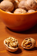 Walnut on brown wooden background. Selective focus