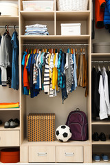 Fototapeta premium Large wardrobe with teenager clothes, shoes and accessories