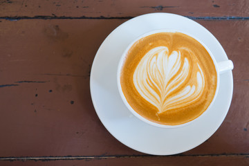 hot latte art coffee on wood table, relax time