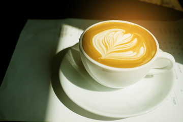 hot latte art coffee on wood table, relax time