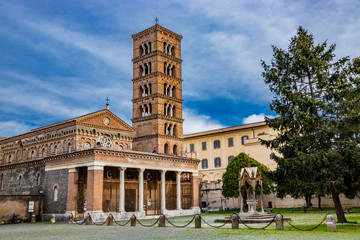 The church, the bell tower, and the liturgical fountain 