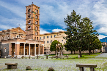 The church, the bell tower, and the liturgical fountain 