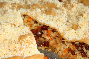 Balish is a traditional dish of national Tatar cuisine. Pie with raisins and rice. Close-up. Background.