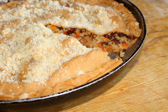 Balish is a traditional dish of national Tatar cuisine. Rice and raisin cake. Close-up. Background.