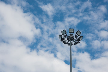High Mast light pole on a background of a cloudy sky