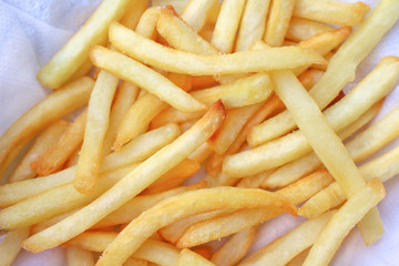 Top view french fries in white paper background