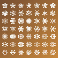 collection of golden vector snowflakes on white background