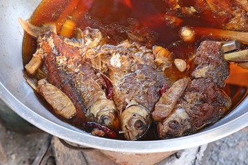 Boiled fish sauce at market