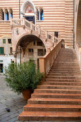 Fototapeta na wymiar VERONA, ITALY : Ancient staircase by 15 century called Ladder of Justice in Palazzo della Ragione, center of Verona, Italy.