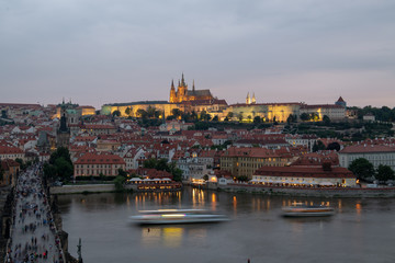 Fototapeta na wymiar Prague, Czech Republic. Charles Bridge and Hradcany (Prague Castle) with St. Vitus Cathedral and St. George church evening dusk, Bohemia landmark in Praha.