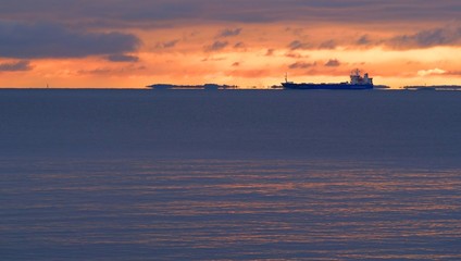 Freight ship at the horizon