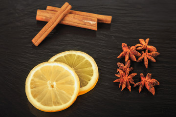 lemon slices, cinnamon sticks and star anise