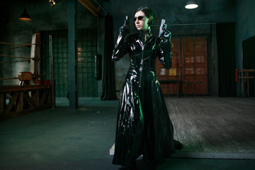 Computer viruses and cybersecurity, concept. young woman dressed in matrix style.