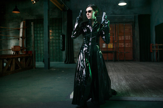 Computer viruses and cybersecurity, concept. young woman dressed in matrix style.