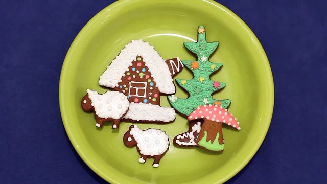 hand fast puts composition of gingerbread cookies on a plate(timelapse), traditional Russia North (Arkhangelsk) christmas bakery 