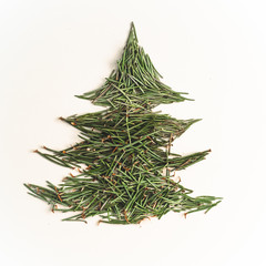 Christmas tree needles on the white Background. Pine tree branches. New Year Concept. 