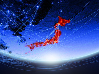 Japan on green model of planet Earth with network representing blue digital age, travel and communication.