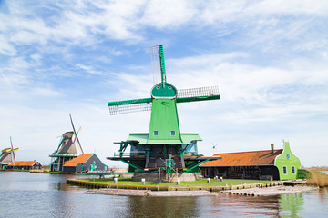 Fototapeta na wymiar Landscape of well-preserved historic windmills and houses